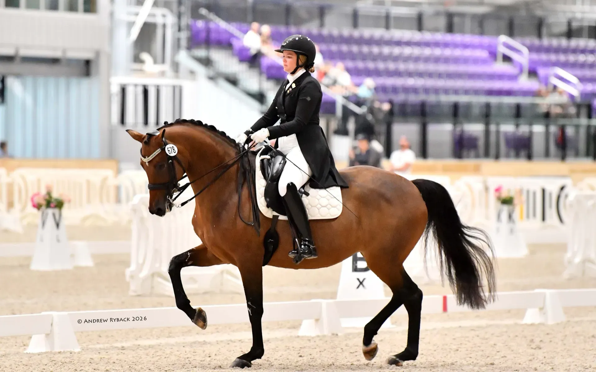 Caroline riding a dressage test in competition