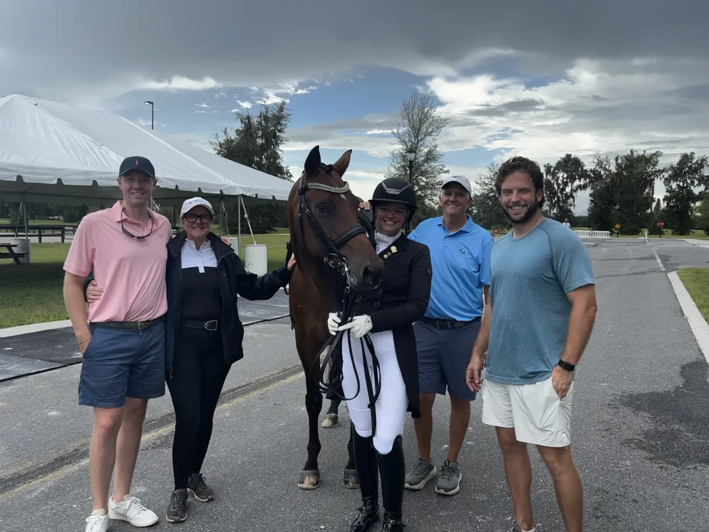 Caroline and her horse with the OnPointe team at a horse show